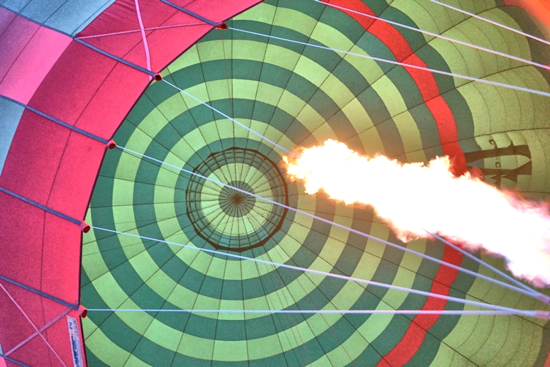 Looking up at the flame in a soaring Hot Air Balloon