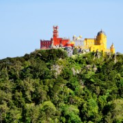 Approaching the Pena Palace in the Sintra hills by air. It is a Romanticist castle built in 1836 AD in Sintra, Portugal.